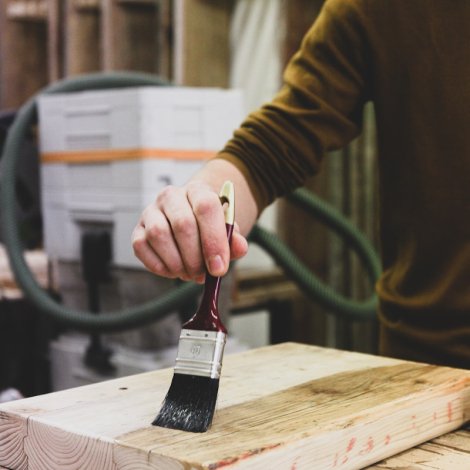person holding black and white paint brush